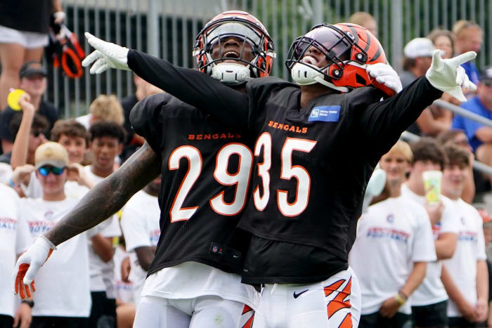 Cincinnati Bengals cornerback Jalen Davis (35) celebrates a pass defense with Cincinnati Bengals cornerback Cam Taylor-Britt (29) during Cincinnati Bengals training camp practice, Thursday, Aug. 4, 2022, at the Paul Brown Stadium practice fields in Cincinnati. Cincinnati Bengals Training Camp Aug 4 0613